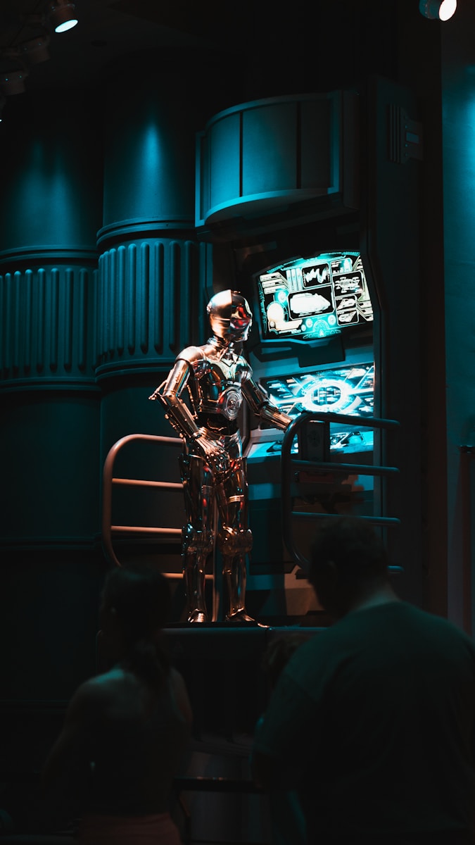 a man standing in front of a tv in a dark room